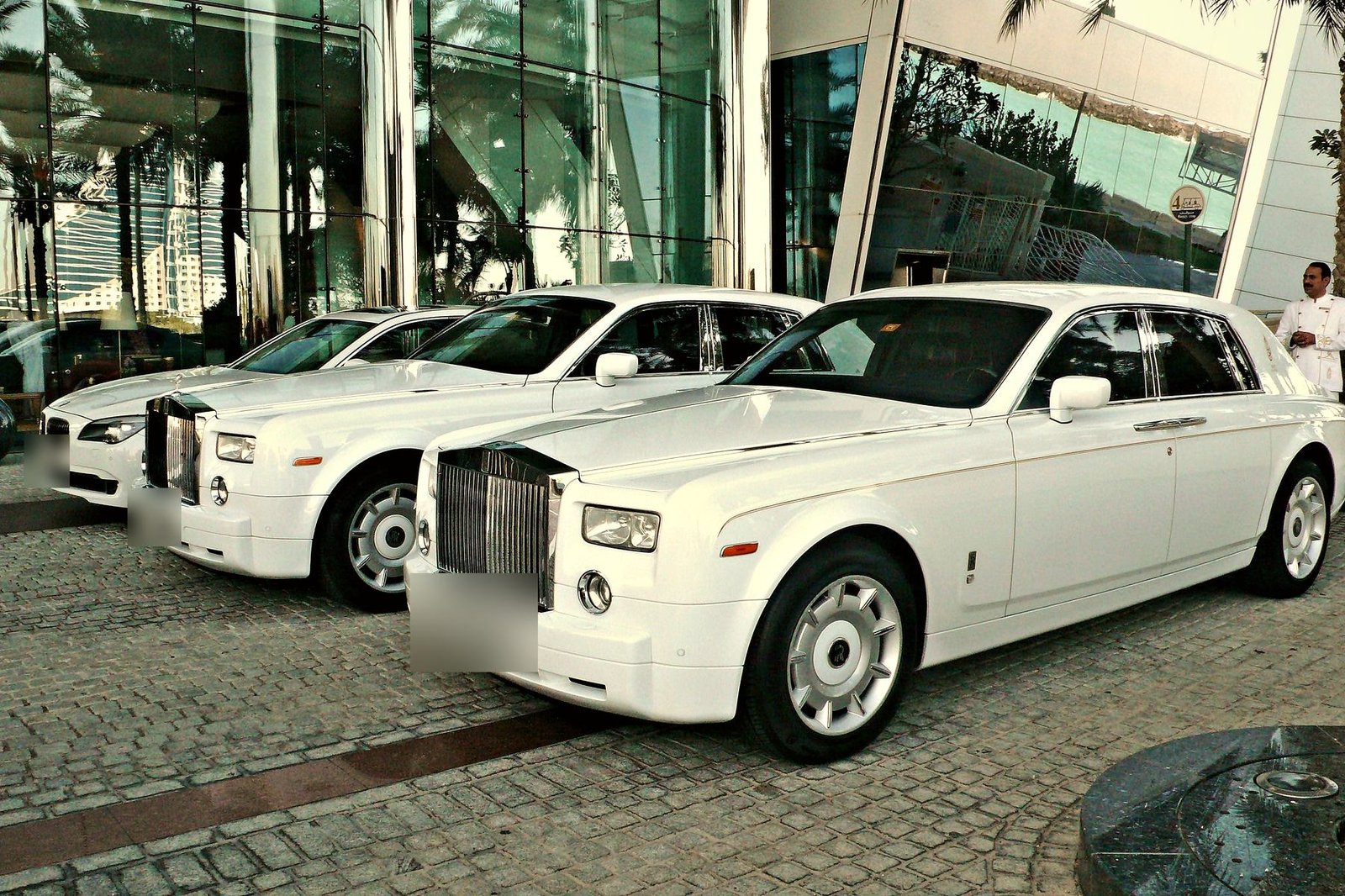 White Rolls-Royce Phantoms waiting outside a Dubai hotel